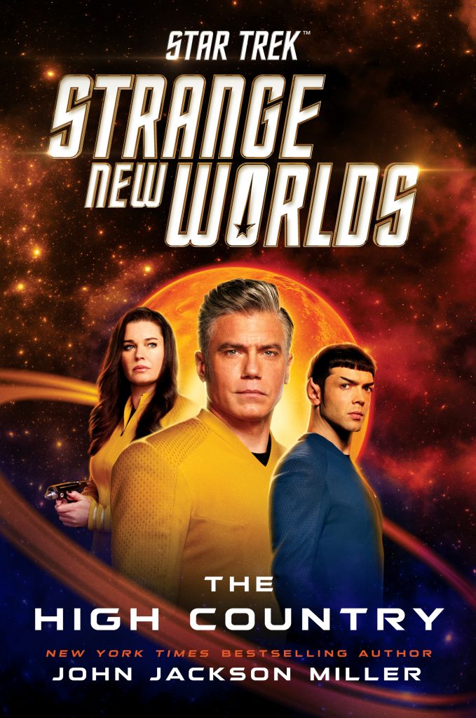 Cover for "The High Country", showing Captain Pike, flanked by Una Chin-Riley and Spock. In the background a red sun, stars and a planetary ring.